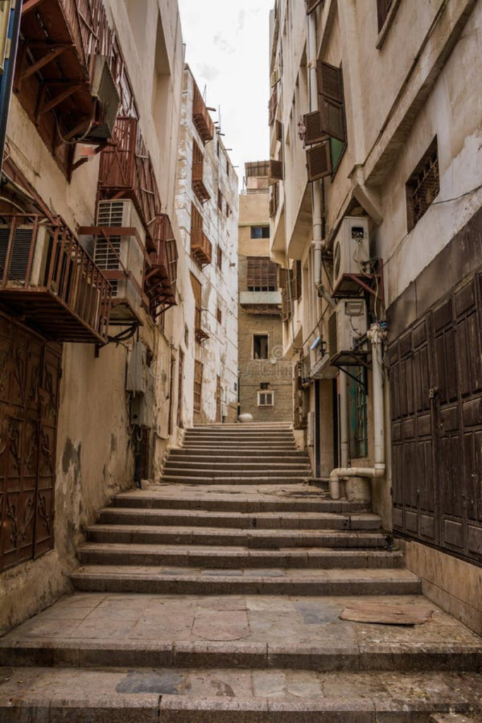 Photographer exploring the streets of Al Balad